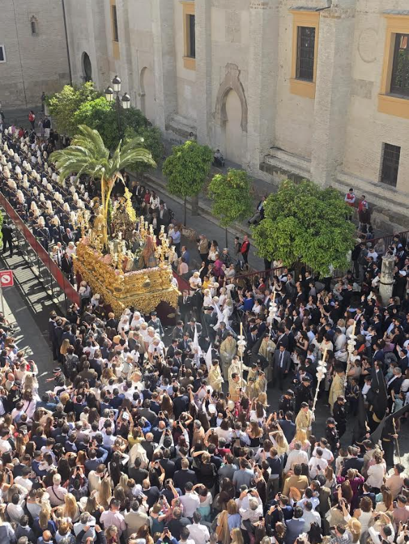 A procession moving beneath the balcony